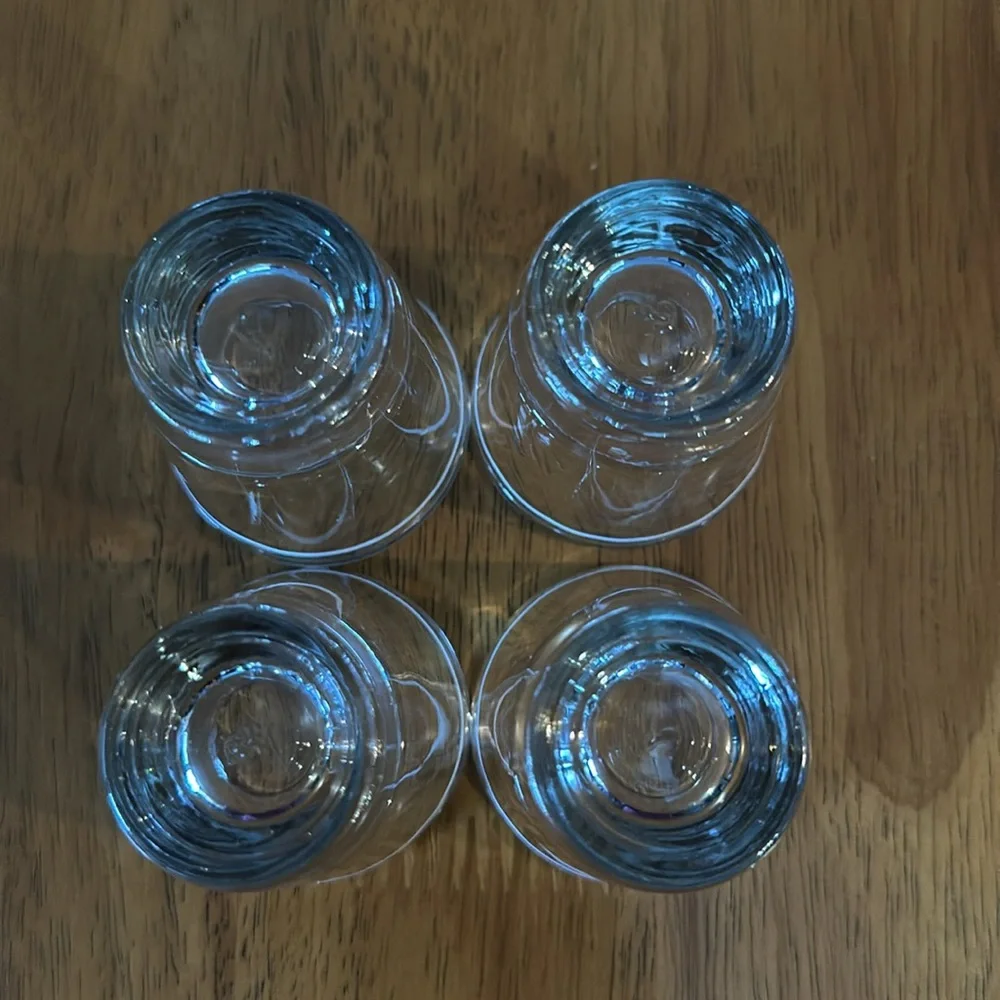 Anchor Hocking shot glasses. Clear with white stripe. Originally from Starbucks
